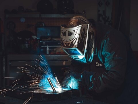 Far from the X-ray machine, Mark Belles indulges in some signature craftmanship while welding a new creation in his garage-turned-workshop.