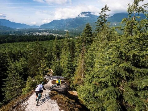 While Squamish, BC has long been known for granite slabs, its progressive land-management strategies might soon be the talk of the town. Stephen Matthews and Sid Slotegraaf drop into Dirk’s Diggler with stunning views of the Howe Sound. Photo: Reuben Krabbe