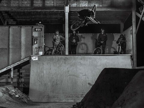For Bellingham’s hardcore bikers, the Bike Ranch is a frequent hangout during winter months. Billy Lewis blasts out of the quarter pipe as the rest of the crew watches on.